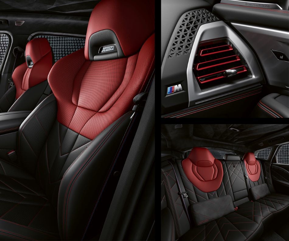 Detail of front seats, clad in exclusive BMW Individual Fiona Red & Black Merino Leather with exclusive M Signature Trim and red stitching and accents. Detail of red accented vent. Detail of rear M Lounge with exclusive XM pillows in BMW of Newton | Newton NJ