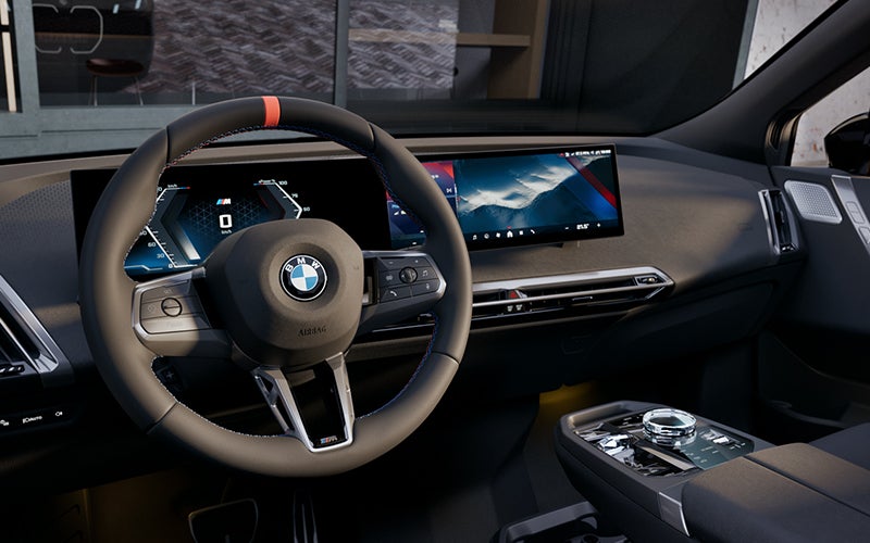 Interior steering wheel and dashboard of the BMW iX M70. | BMW of Newton in Newton NJ