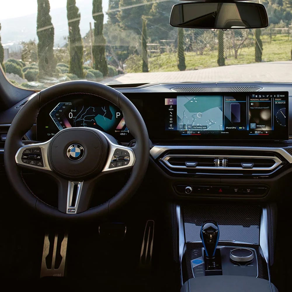 A driver's eye view of steering wheel and controls of the BMW i4 | BMW of Newton in Newton NJ